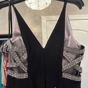 XSCAPE Black long formal dress with rhinestone side panels with slit. Size 6